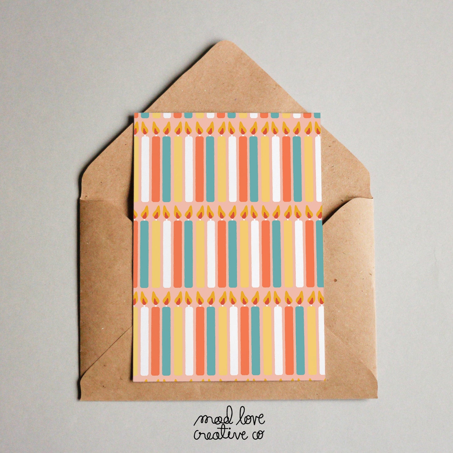 Birthday card with a multi coloured candle pattern.