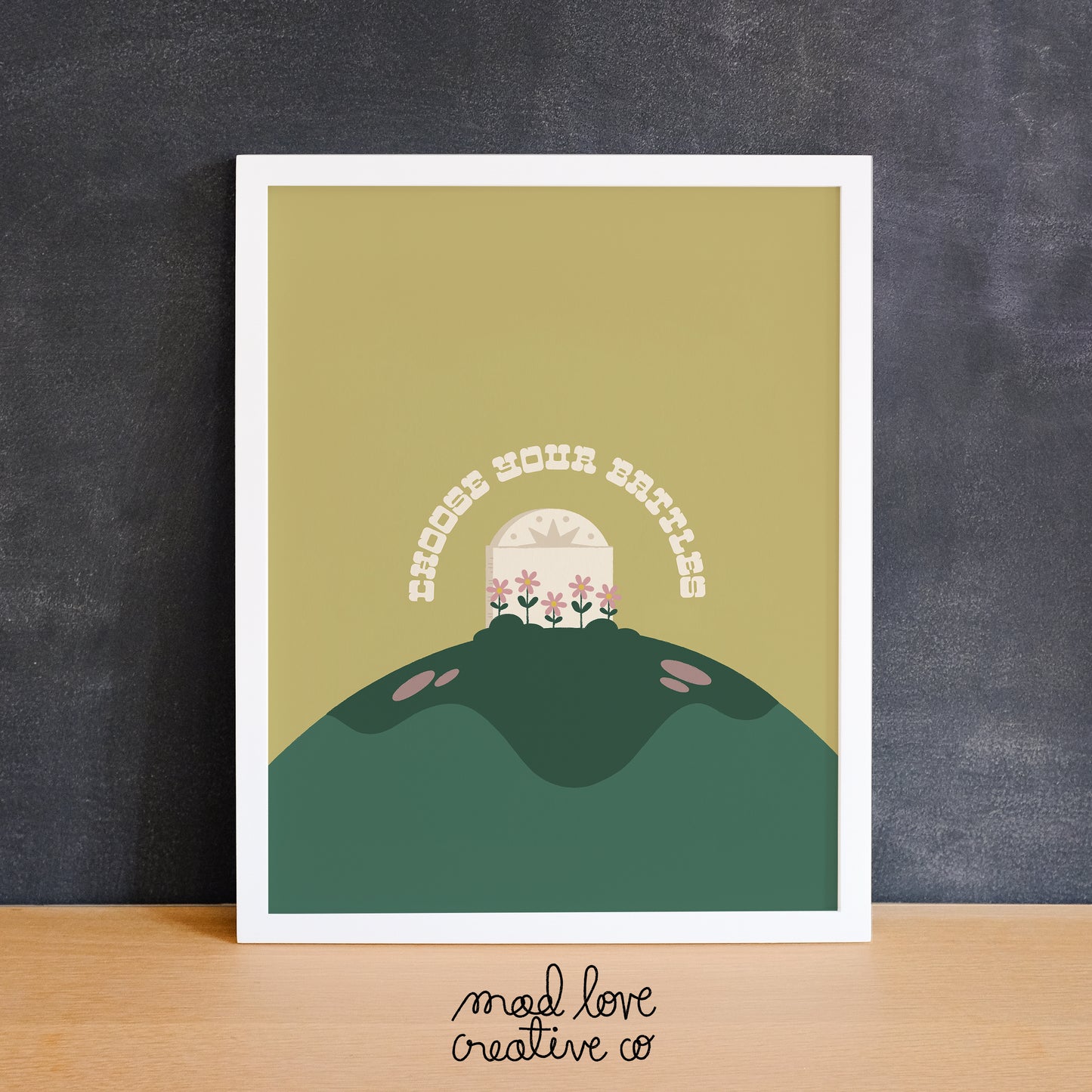 Colourful art print with a grave stone on a hill and flowers that says "choose your battles". Made in Canada by Mad Love Creative Co.