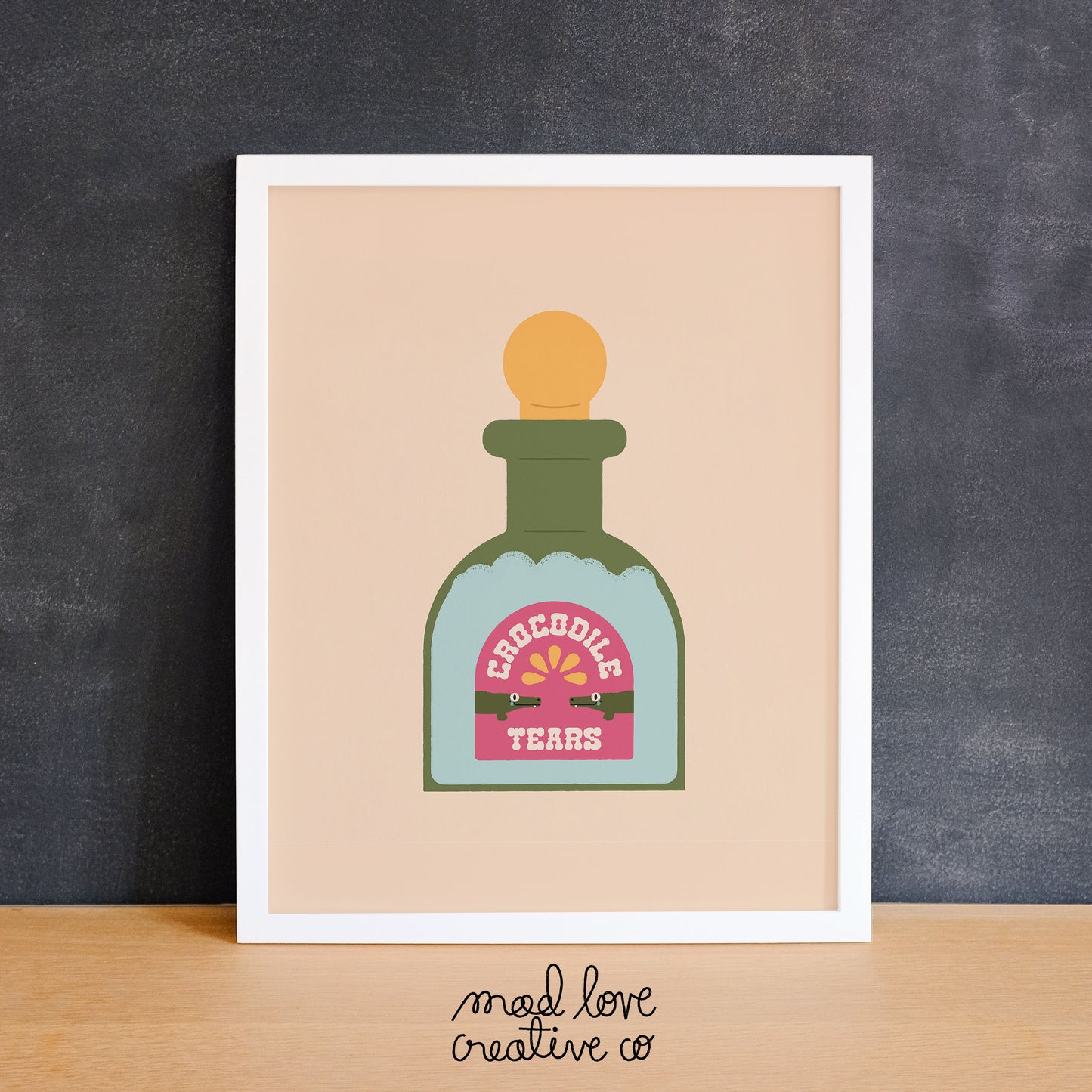 Cute potion bottle print with crocodiles on it that says "crocodile tears". Made in Canada by Mad Love Creative Co.