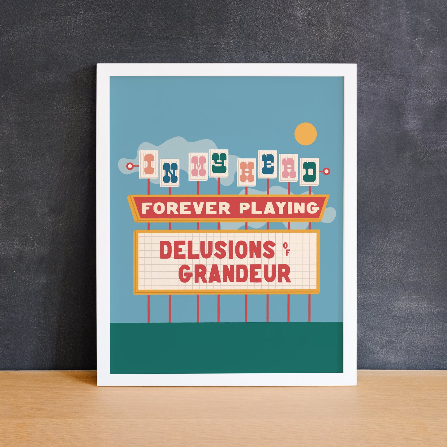 Colourful print of a retro neon movie theatre sign that says "delusions of grandeur". Made in Canada by Mad Love Creative Co.