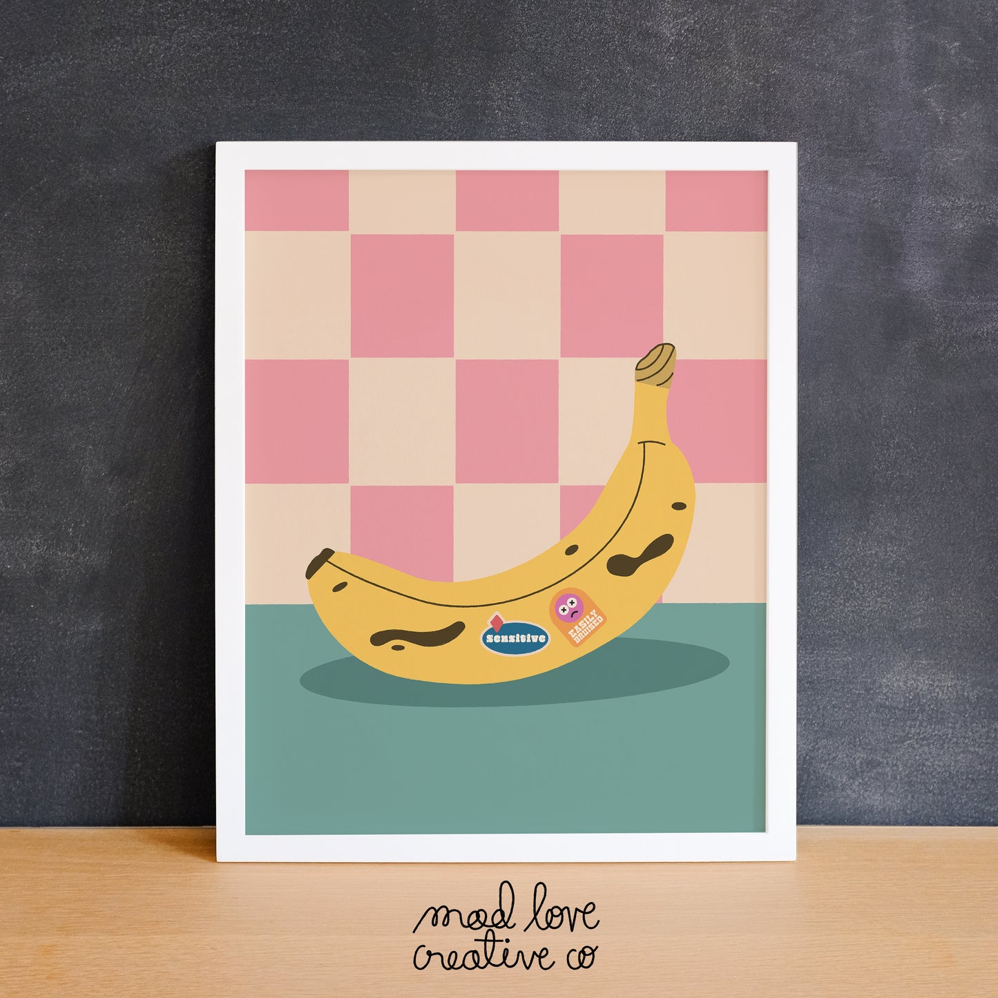 Funny print featuring a banana with stickers that says "sensitive" and "easily bruised". Made in Canada by Mad Love Creative Co.