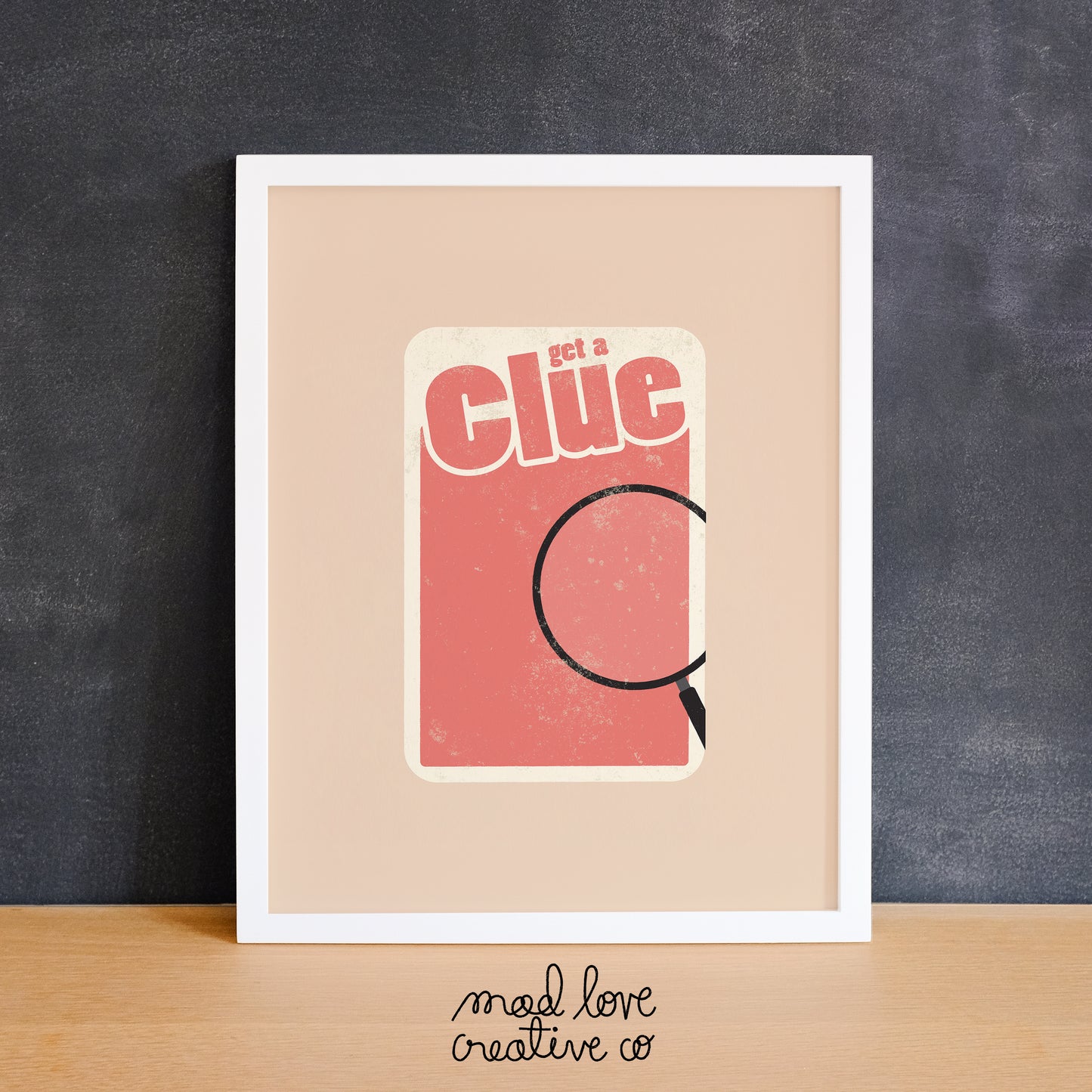 Funny board game theme print featuring a magnifying glass that says "get a clue". Made in Canada by Mad Love Creative Co.