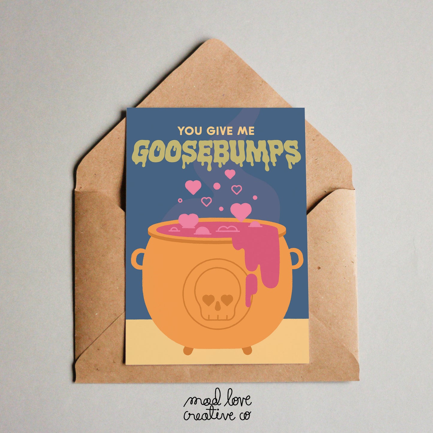 Cute spooky love theme card with a bubbling cauldron with the text "you give me goosebumps". Made in Canada by Mad Love Creative Co.