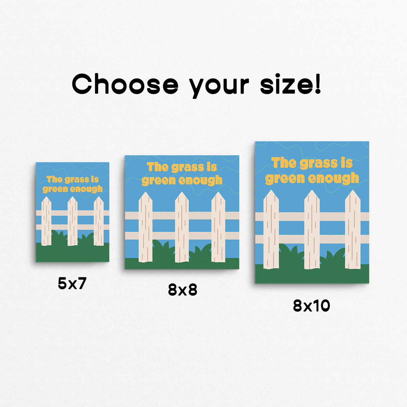 Bright print of a white picket fence on green grass with the phrase "the grass is green enough". Made in Canada by Mad Love Creative Co.