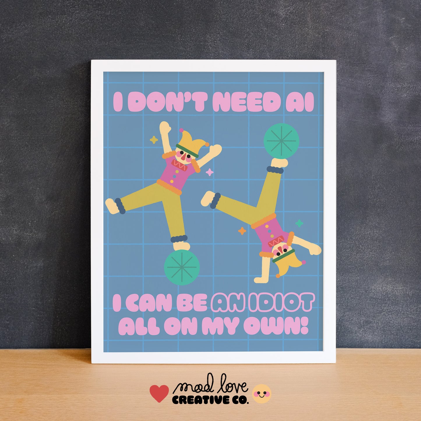 Cute print of jesters doing cartwheels with the text "I don't need AI, I can be an idiot all on my own" in pink text. Made in Canada by Mad Love Creative Co.