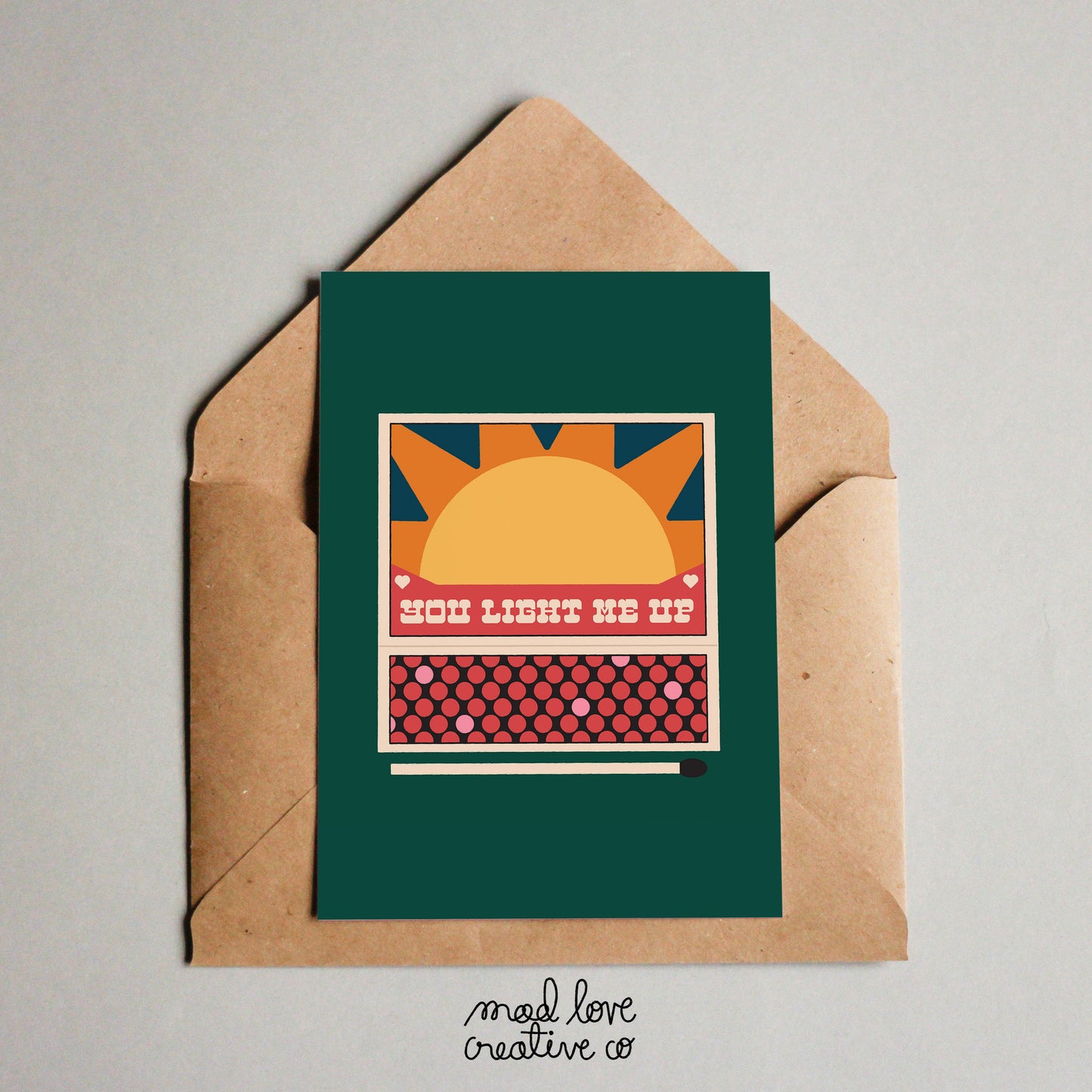 Cute love card featuring a match box that says "you light me up". Made in Canada by Mad Love Creative Co.
