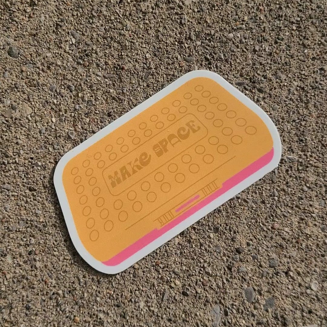 Cute pencil box Spacemaker inspired sticker that says "Make Space". Made in Canada by Mad Love Creative Co.