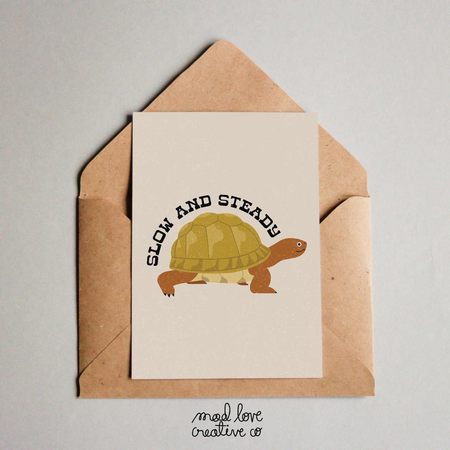 Cute greeting card with a tortoise that says "slow and steady". Made in Canada by Mad Love Creative Co.
