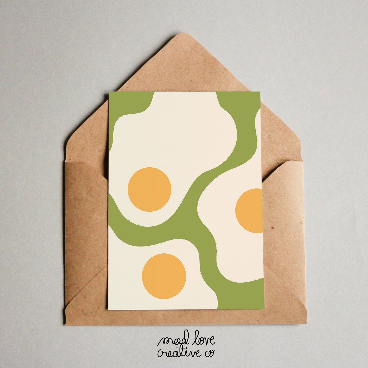 Cute just because card featuring sunny side up eggs on a green background. Made in Canada by Mad Love Creative Co.