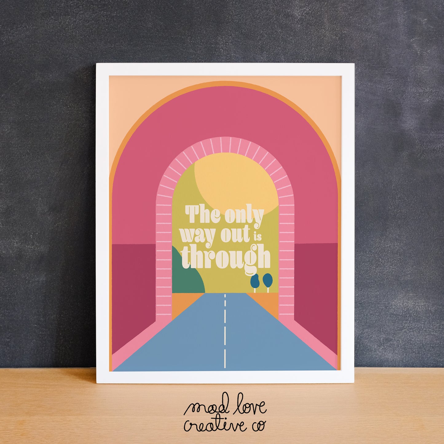 Colourful print of a tunnel and landscape view with the text "the only way out is through". Made in Canada by Mad Love Creative Co.