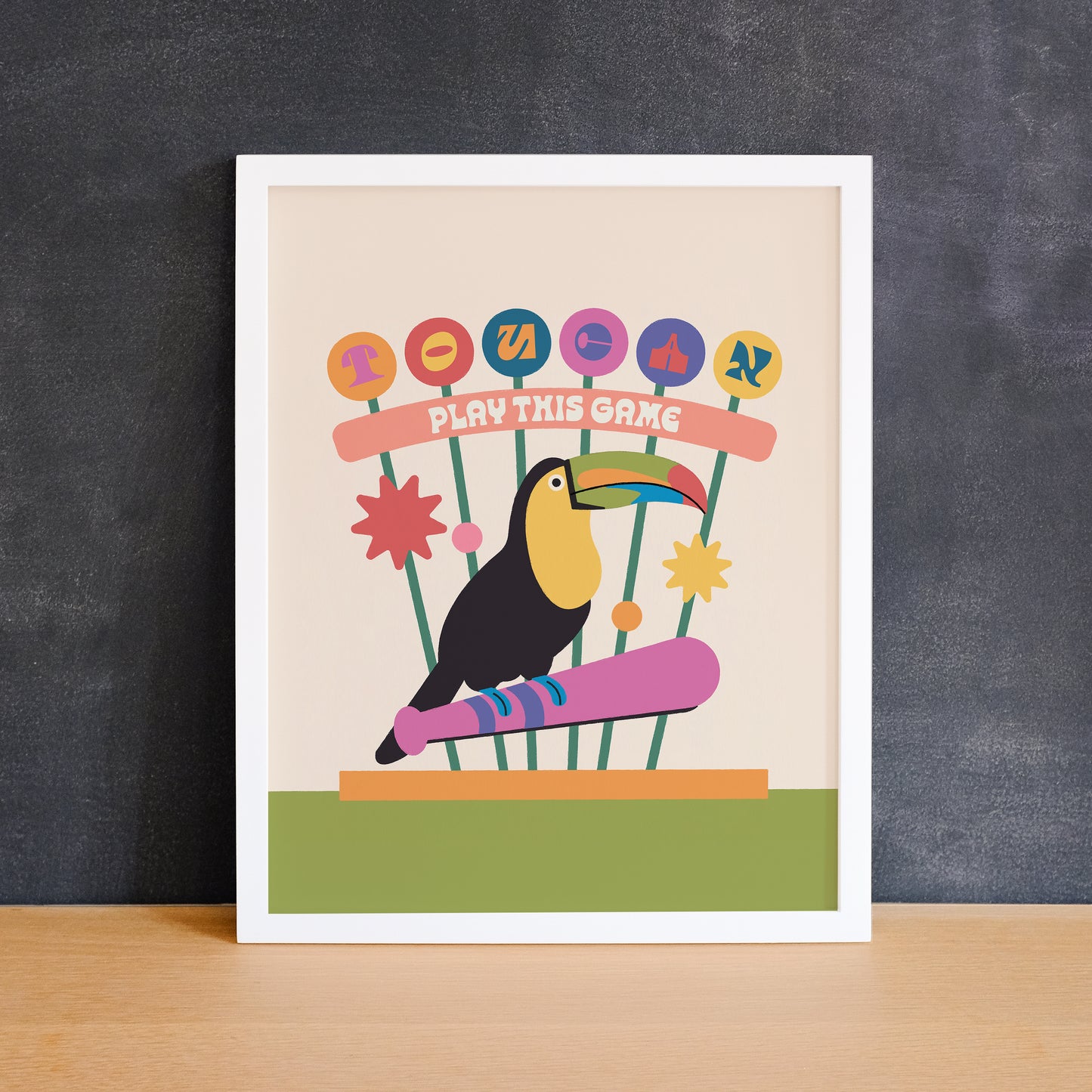 Fun colourful print of a toucan on a baseball bat with the phrase "toucan play this game". Made in Canada by Mad Love Creative Co.