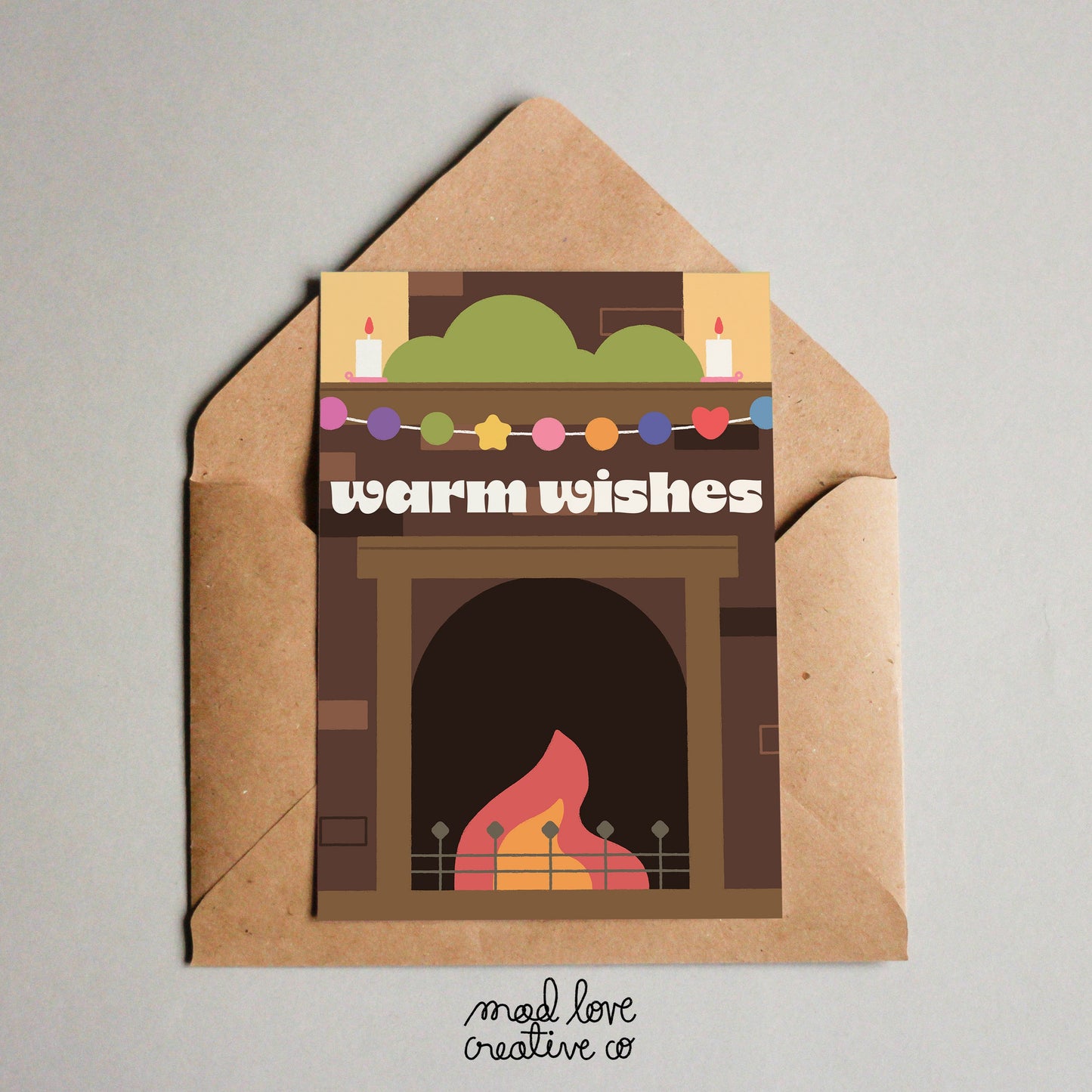 Cute holiday card of a fireplace with the text "warm wishes". Made in Canada by Mad Love Creative Co.