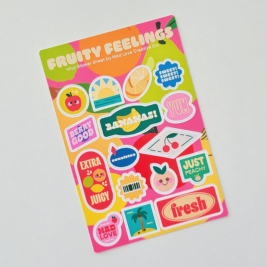 Sticker sheet with colorful fruit-themed designs on a gray background