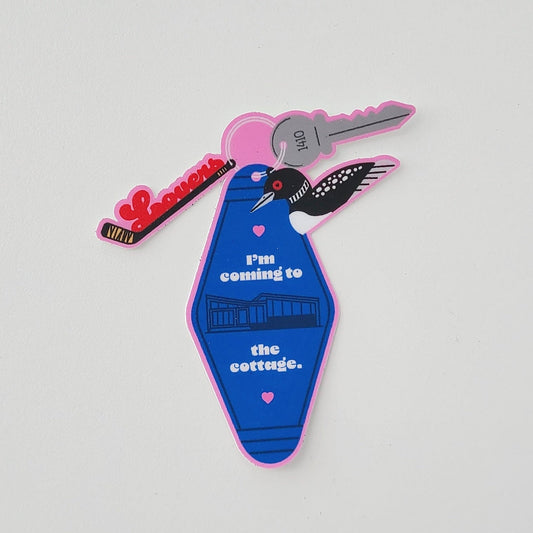 Heated Rivalry inspired Cottage motel keychain sticker. Made in Canada by Mad Love Creative Co. 