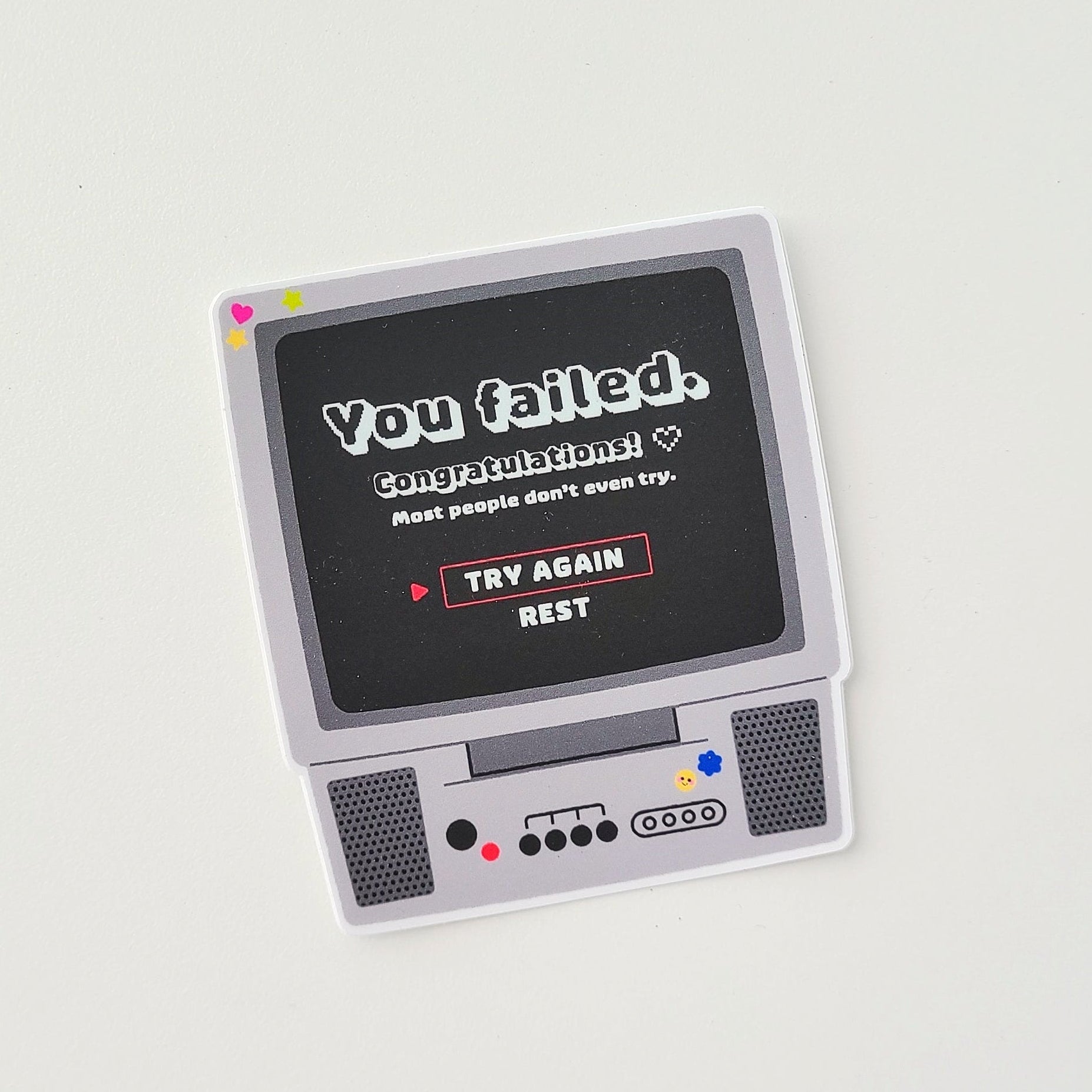 Vintage-style electronic device with a screen displaying text on a light gray background