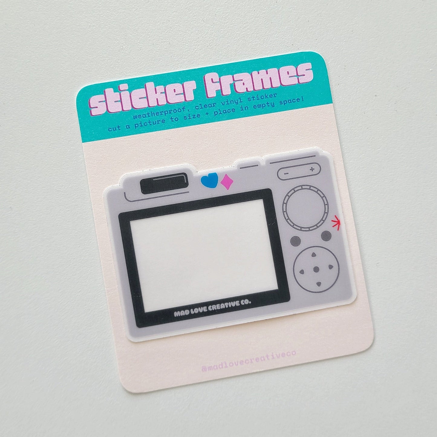 Sticker frame with a retro digital camera design on a gray background