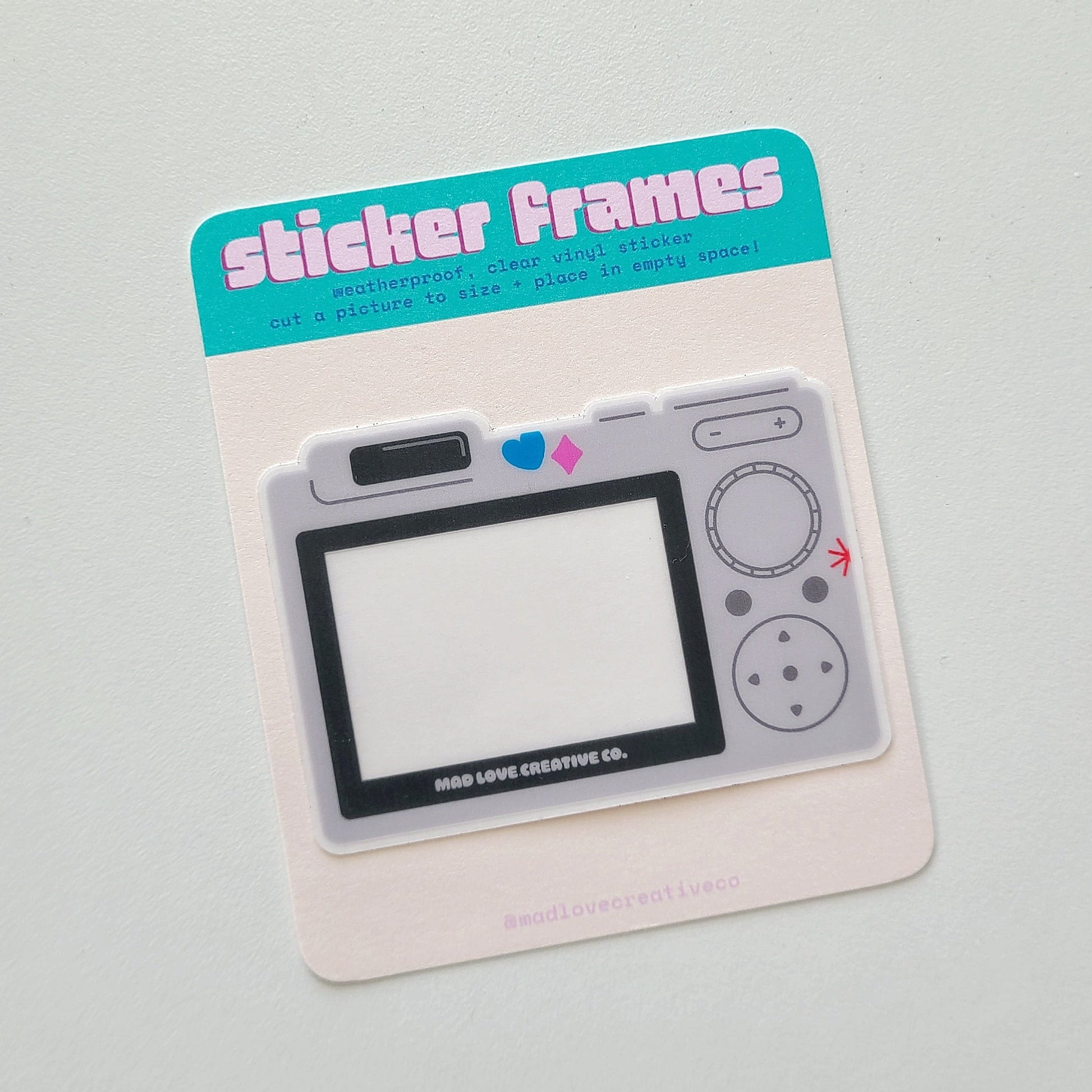 Sticker frame with a retro digital camera design on a gray background