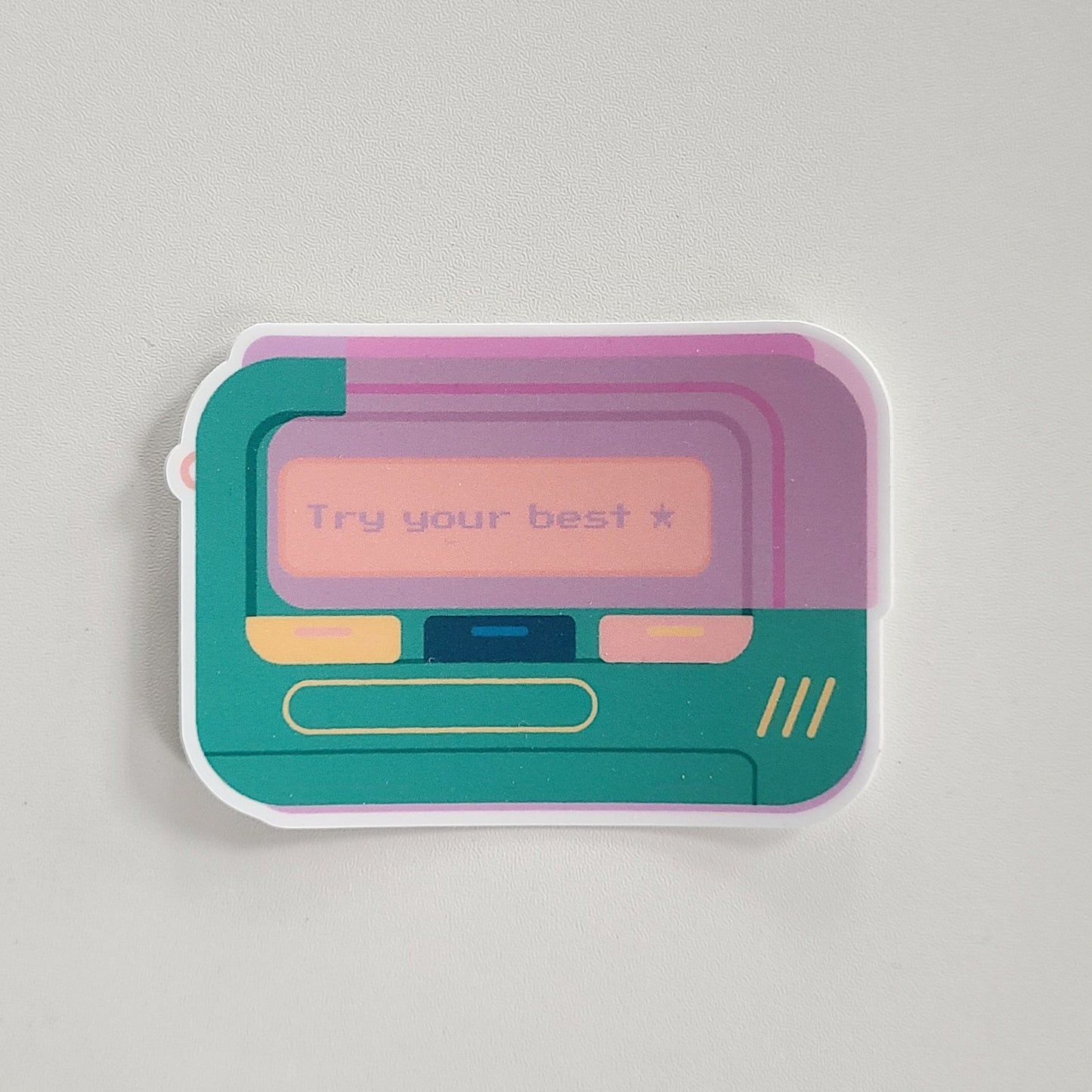 Cute vinyl sticker of a retro beeper pager with the text "try your best". Made in Canada by Mad Love Creative Co.