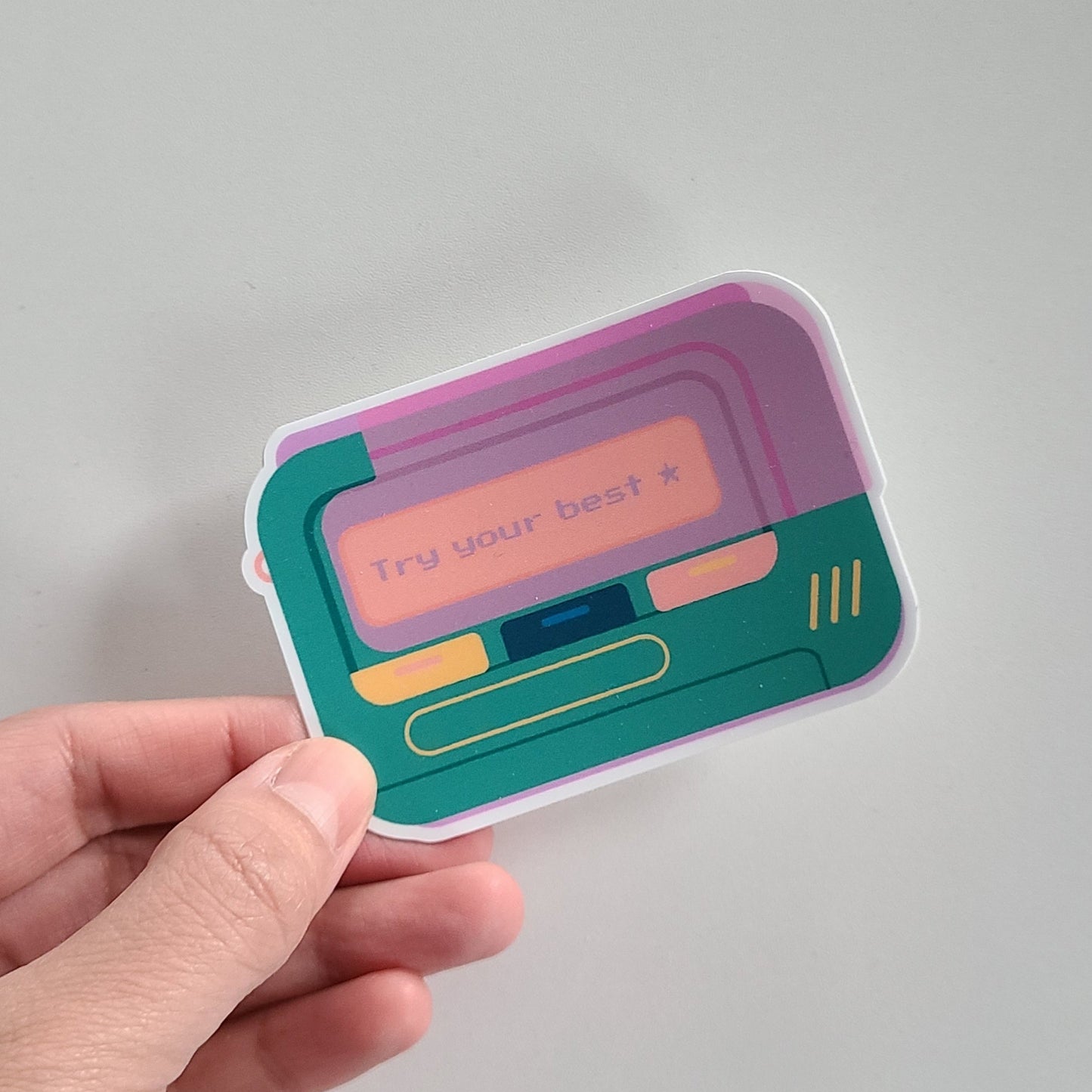 Cute vinyl sticker of a retro beeper pager with the text "try your best". Made in Canada by Mad Love Creative Co.