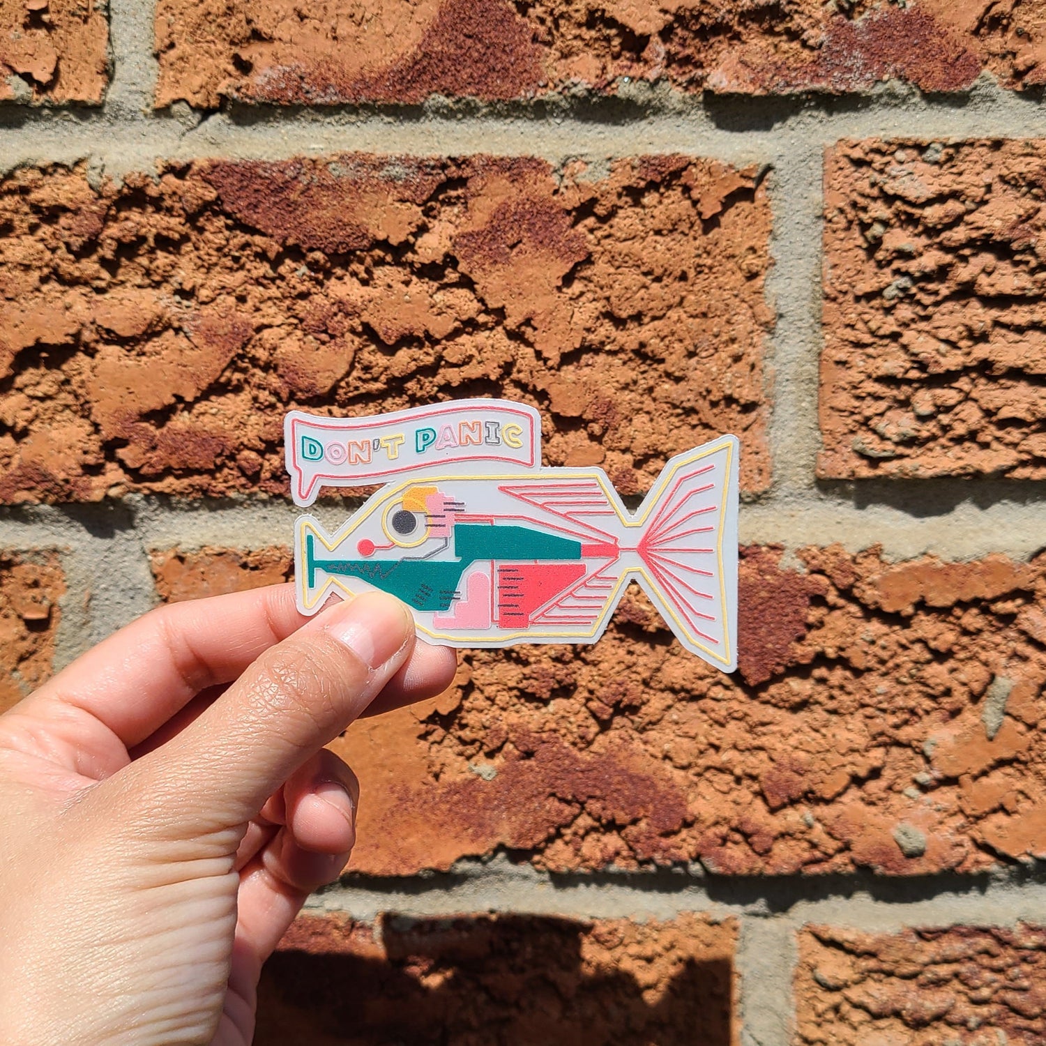 Cute babelfish sticker inspired by Hitchhikers guide to the galaxy. Made in Canada by Mad Love Creative Co. 