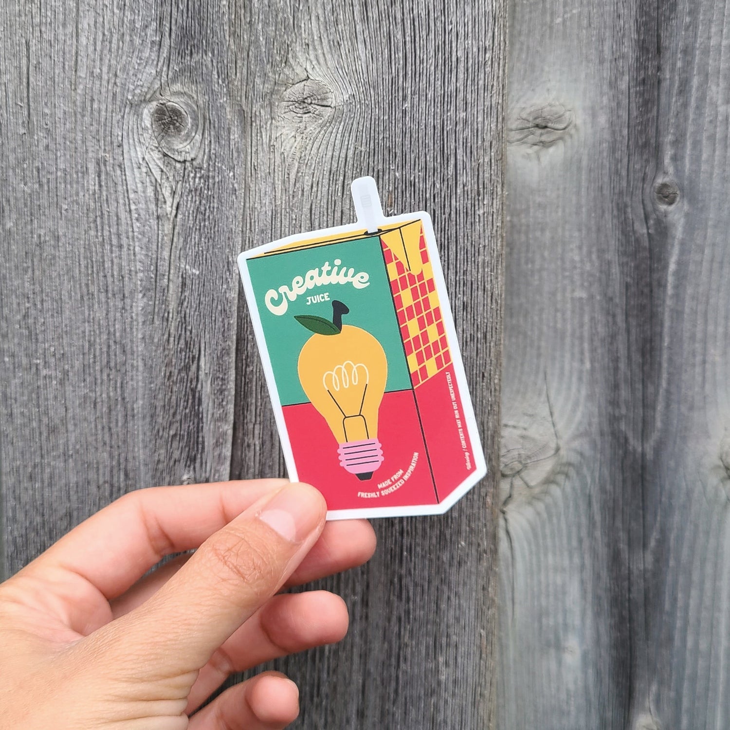 Cute vinyl juice box sticker with a lightbulb that says "Creative Juice". Made in Canada by Mad Love Creative Co.