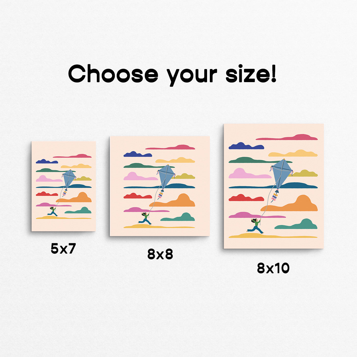 Three different sizes of a colorful art print with kites and mountains on a white background. Made in Canada by Mad Love Creative Co. 