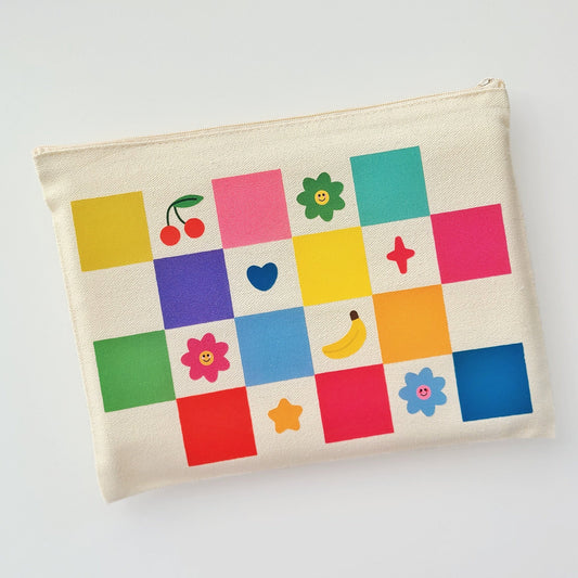 Canvas pouch with colorful square patterns and icons on a white background
