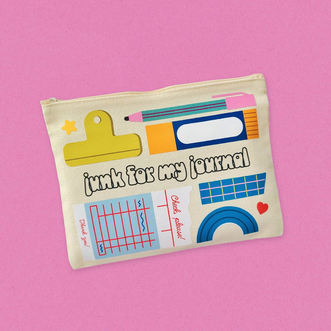 Pouch with stationery-themed design on a pink background