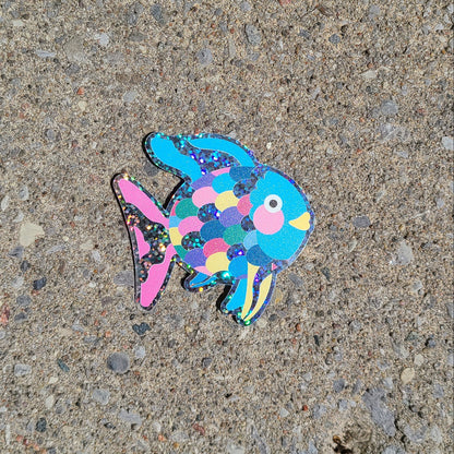 Bright blue glittery vinyl sticker of the children's book character, Rainbow Fish. Made in Canada by Mad Love Creative Co.