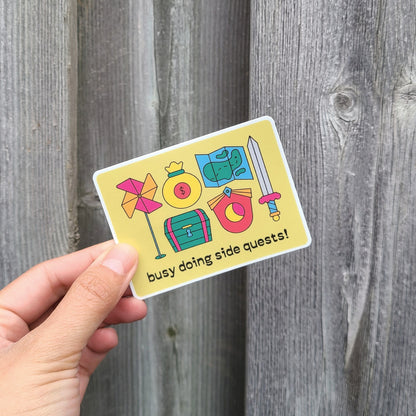 Quirky video game inspired sticker for side quests lovers. Made in Canada by Mad Love Creative Co. 