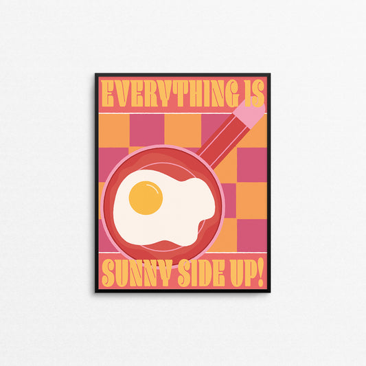 Bright colored checkered print with a sunny side up egg on a frying pan with the text "everything is sunny side up". Made in Canada by Mad Love Creative Co. 