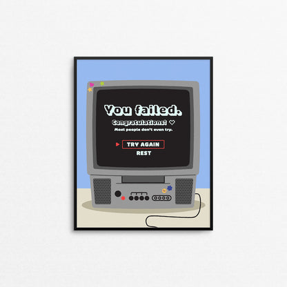 Cute motivational print of a retro 2000s style tv with a video game fail screen that says "you failed, congratulations!". Designed and made in Canada by Mad Love Creative Co.